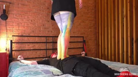 MistressLegs in pantyhose stands on the slave's face