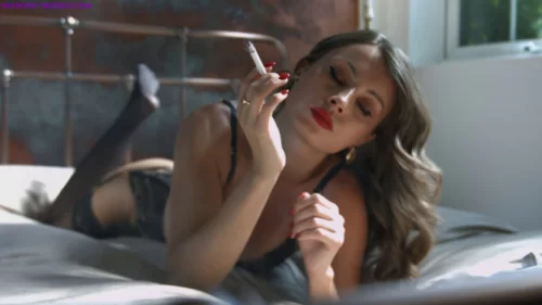 Anna - Smoking corks on her bed while wearing lingerie | Fetish Video